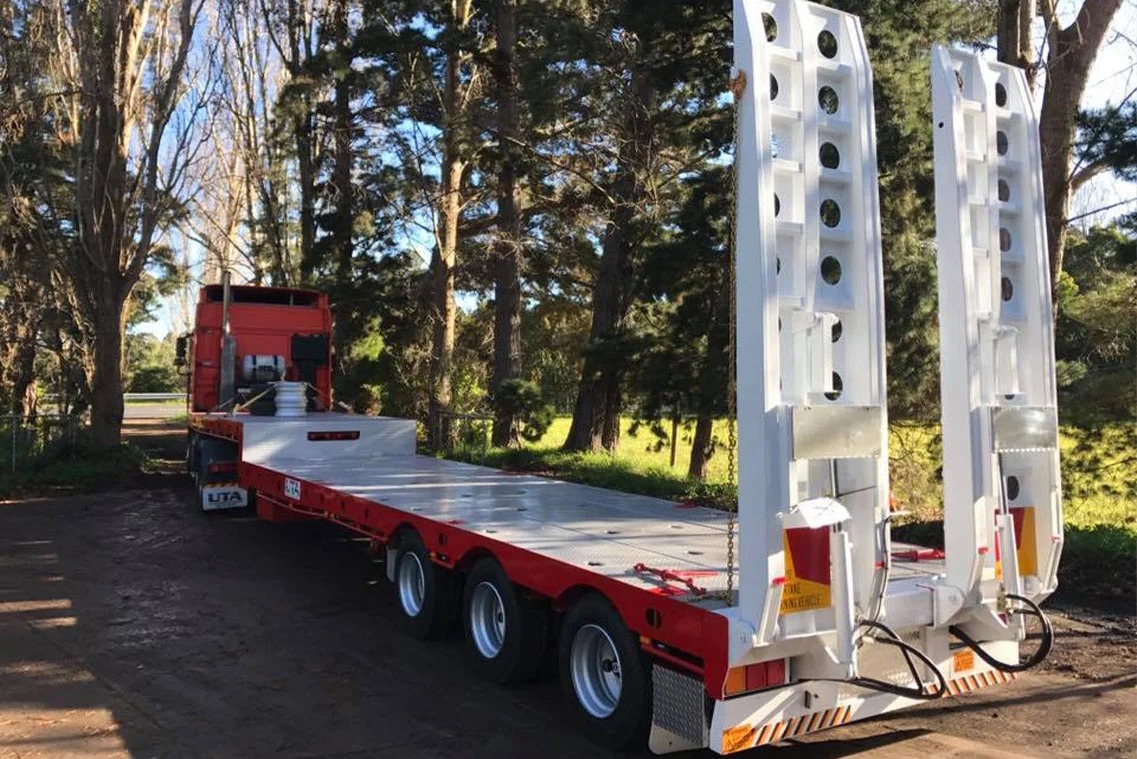 A red drop deck trailer